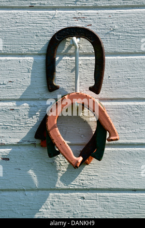 Horseshoes hanging on a barn wall on a farm in Oregon's Wallowa Valley. Stock Photo
