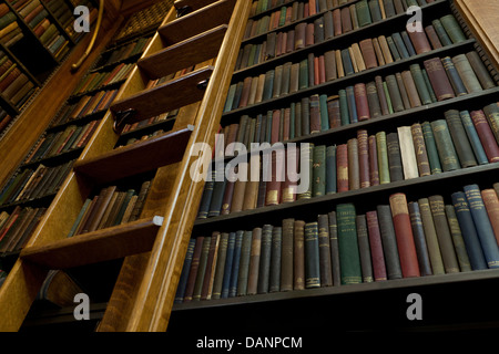Vintage books on shelves in library - USA Stock Photo