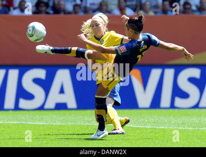 Sweden's Lisa Dahlkvist and Australia's Kyah Simon vie for the ball during the quarter-final soccer match of the FIFA Women's World Cup between Sweden and Australia at the FIFA World Cup stadium in Augsburg, Germany 10 July 2011. Photo: Bernd Weißbrod dpa/lby Stock Photo