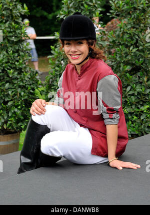 Singer Edita Abdieski waits for the start of the race at the benefit race day for the child protection alliance (Kinderschutzbund) of Cologne at the horse track in Cologne, Germany, 10 July 2011. It is the tenth time that celebrities have helped the child protection alliance by collecting donations. Photo: HENNING KAISER Stock Photo