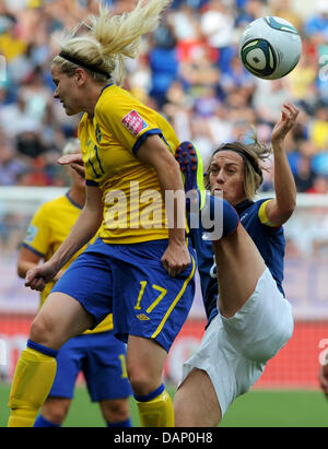 Sweden's Lisa Dahlkvist (l) and France's Sandrine Soubeyrand vie for the ball during the FIFA Women's World Cup third place soccer match between Sweden and France at the Rhein-Neckar-Arena in Sinsheim, Germany 16 July 2011. Photo: Arne Dedert dpa/lsw Stock Photo