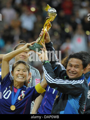 Japan's Homare Sawa (C) and head coach Norio Sasaki (R) celebrate with ...