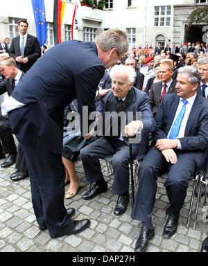 German President Christian Wulff (L) greets former German president Richard von Weizaecker (C) and governing mayor of Berlin Klaus Wowereit at the beginning of a commemorative event at the Memorial to the German Resistance in Berlin, Germany, 20 July 2011. A commemorative event and a wreath-laying ceremony was initiated in remembrance of the death of the people that failed in an at