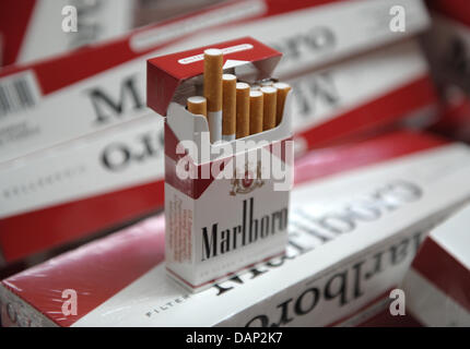 A fake package of Marlboro cigarettes without revenue stamp stands on ...