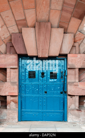 Heavy wooden door with riveted iron straps Stock Photo