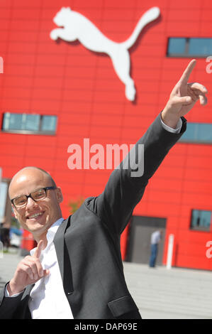 FILE - An archive picture dated 14 April 2011 shows the new CEO of sporting goods manufacturer Puma, Franz Koch, posing in front of the company's home in Herzogenaurach, Germany. The enterprise will present its half-year figures on 27 July 2011. Photo: David Ebener Stock Photo