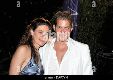 A handout file dated 30 July 2011 shows Italian Fashion designer Francesca Versace, niece of Gianni Versace, posing with the organiser Timo Weber at the event Saint-Tropez-Polo-Trophy 2011 in Saint Tropez, France, 30 July 2011. Photo: KDF Television & Picture Germany / For editorial use only Stock Photo