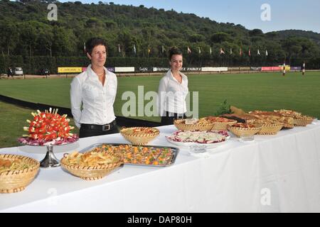 A handout file dated 30 July 2011 shows servive staff standing behind a buffet of the event Saint-Tropez-Polo-Trophy 2011 in Saint Tropez, France, 30 July 2011. Photo: KDF Television & Picture Germany / For editorial use only Stock Photo