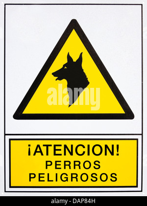 Attention! dangerous dogs signal in spanish language Stock Photo