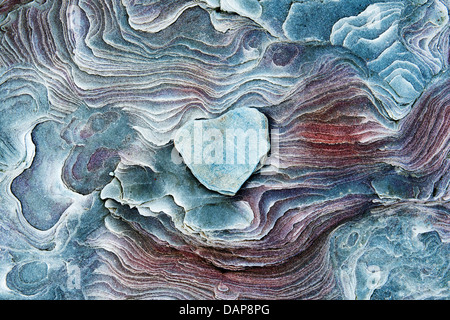 Heart shaped rock on Eroded sandstone pattern. Northumberland Coastline, England Stock Photo