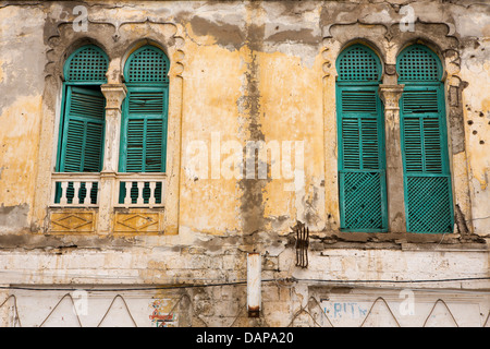 Africa, Eritrea, Massawa, Old Town, green painted wooden shutters of Ottoman style arched house windows Stock Photo