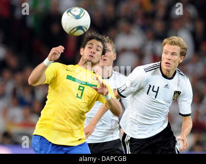 Brazilian player Alexandre Pato (L) and Germany's Holger Badstuber vie for the ball during the friendly match Germany vs. Brazil at the Mercedes-Benz Arena in Stuttgart, Germany, 10 August 2011. Photo: Bernd Weissbrod Stock Photo