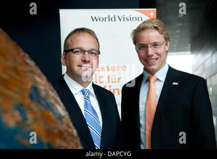 The chairman of the children's aid organisation World Vision Germany, Christoph Waffenschmidt (L) and his representative Christoph Hilligen, pose during the annual press conference in Berlin, germany, 12 August 2011. World Vision Germany calls for a rescue system for the countries at the Horn of Africa and a Task Force to prevent future crises. Photo: JOERG CARSTENSEN Stock Photo