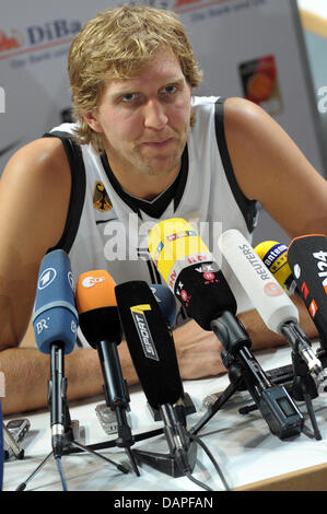 German national basketball player Dirk Nowitzki attends a press conference prior to a training session at the Stechert-Arena in Bamberg, Germany, 17 August 2011. The Basketball Supercup 2011 takes place in Bamberg between 19 and 21 August 2011. Besides Germany, Turkey, Greece and Belgium are part of the competition. Photo: David Ebener Stock Photo