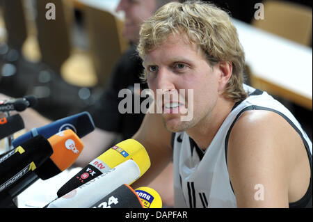 German national basketball player Dirk Nowitzki attends a press conference prior to a training session at the Stechert-Arena in Bamberg, Germany, 17 August 2011. The Basketball Supercup 2011 takes place in Bamberg between 19 and 21 August 2011. Besides Germany, Turkey, Greece and Belgium are part of the competition. Photo: David Ebener Stock Photo