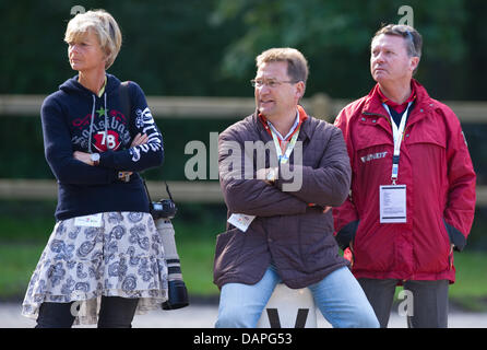 (l-r) Ann Kathrin Linsenhoff, Klaus Martin Rath, the German dressage rider coach Holger Schmezer and watch German dressage rider Matthias Alexander Rath ride his horse Totilas (not pictured) during the training at the European Dressage Championships in Rotterdam, Netherlands, 19 August 2011. Individual competitions will take place on 20 August. Photo: UWE ANSPACH Stock Photo