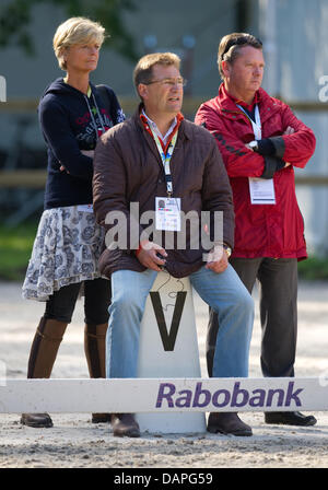 (l-r) Ann Kathrin Linsenhoff, Klaus Martin Rath, the German dressage rider coach Holger Schmezer and watch German dressage rider Matthias Alexander Rath ride his horse Totilas (not pictured) during the training at the European Dressage Championships in Rotterdam, Netherlands, 19 August 2011. Individual competitions will take place on 20 August. Photo: UWE ANSPACH Stock Photo