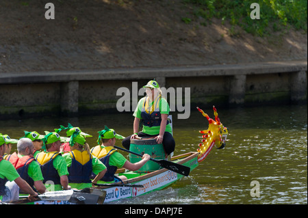 A fancy dress charity event. The 2013 'Help for Heroes' Charity Dragon Boat Race organised by the Rotary Club in York. Crew team Stock Photo