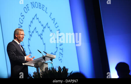 German President Christian Wulff speaks on occasion of the opening of the 4th Meeting in Economic Sciences at the Lindau Nobel Laureate Meetings in Lindau, Germany, 24 August 2011. At the meeting, 17 Laureates and 370 young economists will discuss the future of economy as a scholarly discipline. Photo: Karl-Josef Hildenbrand Stock Photo