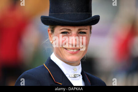 German eventing rider Julia Mestern smiles during the dressage event of the European Eventing Championships in Luhmuehlen, Germany, 25 August 2011. Until 28 August 2011, 70 riders from 14 nationes compete in the events dressage, cross-country and show jumping. Photo: Jochen Luebke Stock Photo