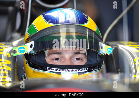 (dpa file) - A file picture dated 07 May 2010 of Brazilian Formula One driver inside his car at the Circuit de Catalunya in Montmelo, near Barcelona, Spain. The nephew of racing legend Ayrton Senna will take over the cockpit of German Nick Heidfeld in the Lotus Renault team for the Belgium GP in Spa on 28 August 2011. Photo: David Ebener