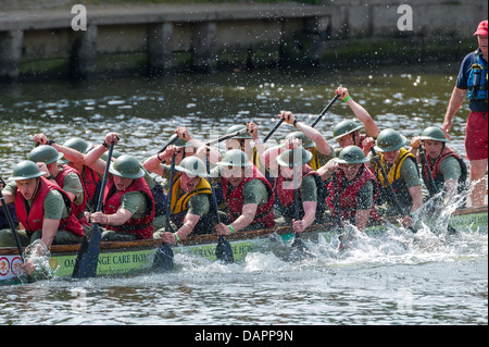 A fancy dress charity event. The 2013 'Help for Heroes' Charity Dragon Boat Race organised by the Rotary Club in York. Crew team Stock Photo