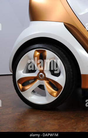 The rear tire of the concept car Smart forvision is seen in Sindelfingen, Germany, 30 August 2011. The concept car, which was built by car manufacturer Daimler and  the chemical corporation BASF, stands out for new technologies for more energy efficiency, lightweight construction, temperature management and design. Photo: MARIJAN MURAT Stock Photo