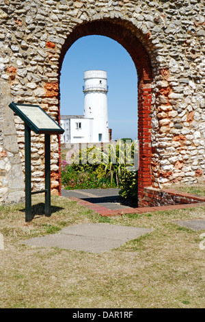 A view of the lighthouse through an arch of the ruined chapel of St Edmund at Hunstanton, Norfolk, England, United Kingdom. Stock Photo