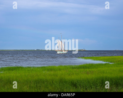 The tall ship Pride sails past Fort Sumter on a sightseeing tour of Charleston Harbor, South Carolina. Stock Photo