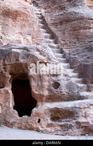 Rock-cut chamber with staircase carved into cliff, Little Petra, Jordan Stock Photo