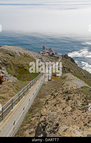 Point Reyes lighthouse with fog on the Pacific Ocean Stock Photo