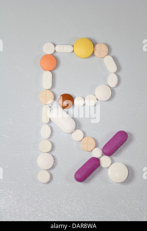 Pills arranged in Rx symbol Stock Photo