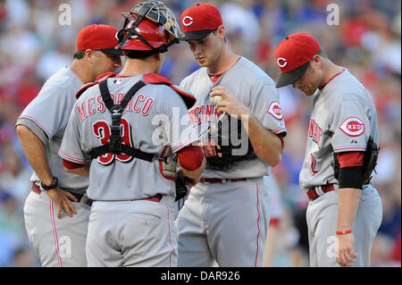 June 28, 2013 - Arlington, TX, USA - Cincinnati Reds' pitching coach Bryan Price (left) visits the mound to talk to pitcher Tony Cingrani (52) after Cingrani walked in two runs during an MLB baseball game between the Cincinnati Reds and the Texas Rangers at the Rangers Ballpark in Arlington in Arlington, TX, Friday, June 28, 2013. Stock Photo