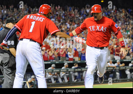 Texas Rangers' Josh Hamilton, left, reaches back to hit Elvis Andrus,  right, on the head with a rosin bag as the two joke around during a  baseball team practice for the World