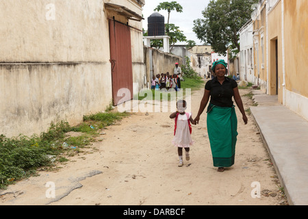 Africa, Mozambique, Mozambique Island. Mother picking up child from school. Stock Photo