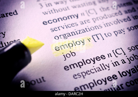 Selective focus on the employ word in the dictionary Stock Photo