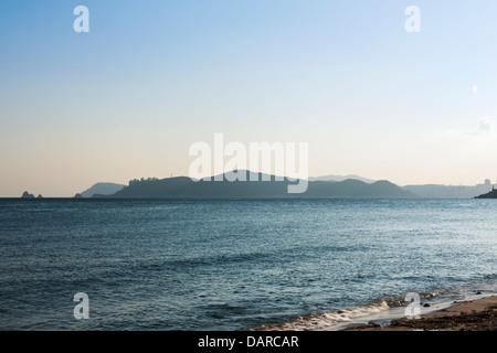 View from Haeundae Beach in Busan towards Nam-gu in Southern Busan and Oryukdo islands during sunset on a windy evening. Stock Photo