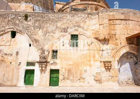 Israel Jerusalem Old City Church of the Holy Sepulchre - Ethiopian Monastery over Chapel of St Helena Helen green doors window shutters Stock Photo