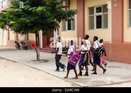 Africa, Mozambique, Mozambique Island. School children walking down street in uniform. Stock Photo