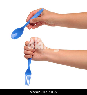 Hand holding spoon on white isolation. Stock Photo