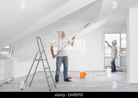 Couple painting apartment Stock Photo