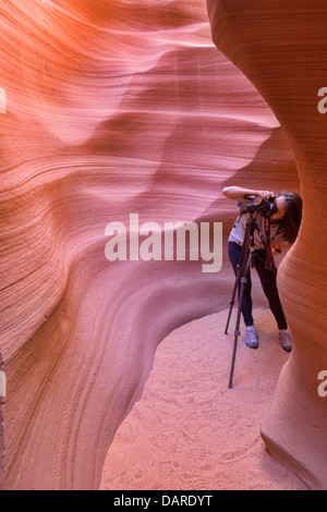 Photographer inside Lower Antelope Canyon, Page, Arizona. Stock Photo