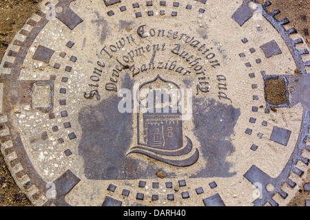 Africa, Tanzania, Zanzibar, Stone Town. Close-up shot of manhole cover on street.