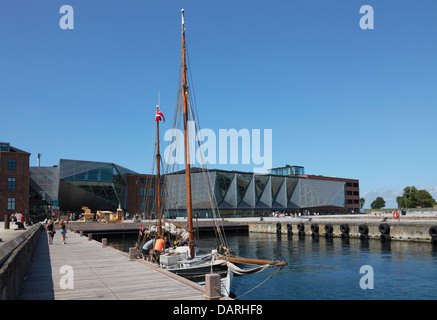 Old sailing ship in front of The Culture Yard on the waterfront in the harbour of Elsinore, Helsingør, Denmark. Stock Photo