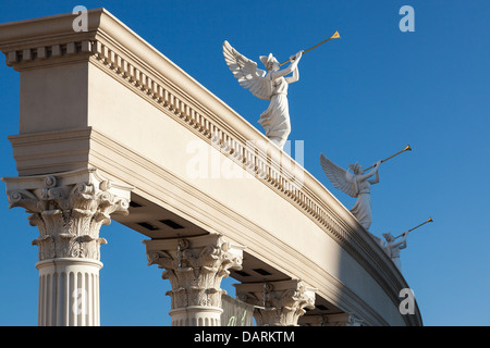 Angels playing golden bugles Stock Photo