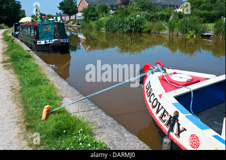 Holiday Narrow Boats Moored on Trent and Mersey Canal at Rode Heath Cheshie England United Kingdom UK Stock Photo