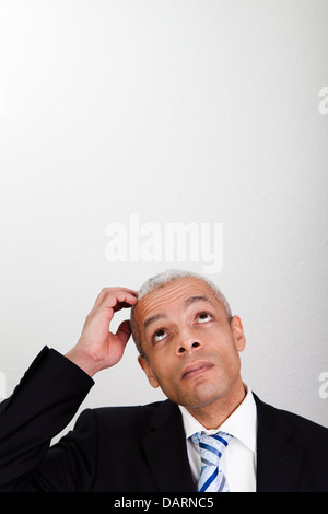 Businessman looking up Stock Photo