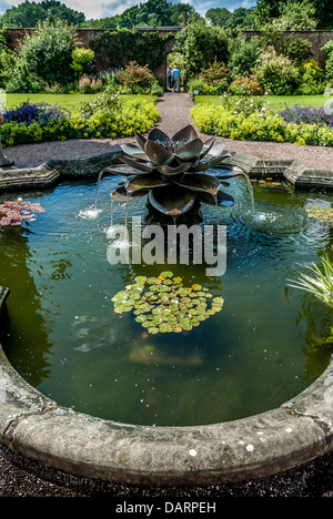 Large ornate garden pond with water lilies - John Gollop Stock