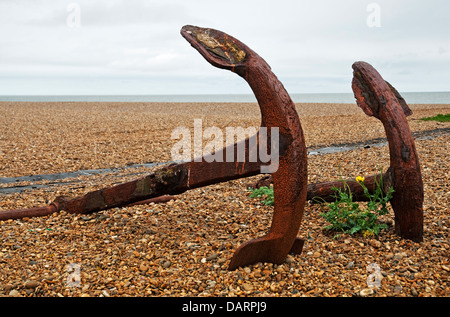 Landscape image showing two large rusty ships' anchors on the beech at Aldeburgh, Suffolk. Stock Photo