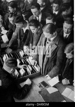 events, Great Depression 1929 - 1933, unemployment, young men in job centre, after photograph, circa 1930, historic, historical, 20th century, 1930s, 30s, card index, public official, searching for jobs, unemployed persons, Germany, German Reich, Weimar Republic, people, 1920s, Additional-Rights-Clearences-Not Available Stock Photo